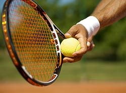 Collaborate with professional Spanish trainers on tennis camp in Barcelonas