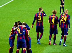 Barcelona players celebrating Suarez goal