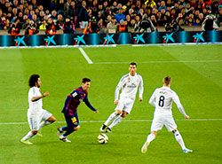 Messi dribbling Cristiano Ronaldo and Real Madrid players